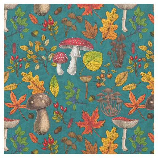 Autumn mushrooms, leaves, nuts and berries on blue fabric