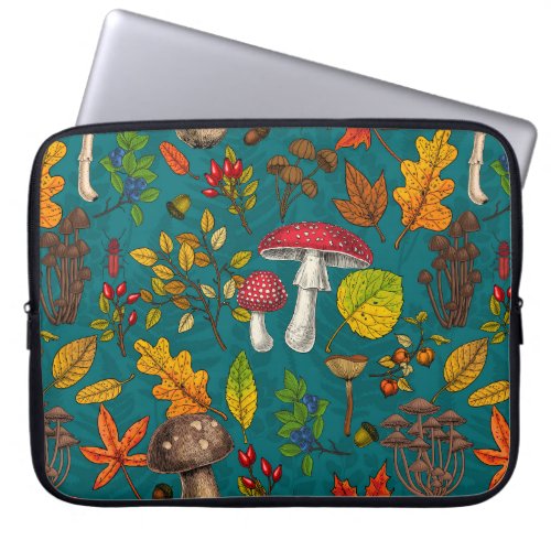 Autumn mushrooms leaves nuts and berries on blue laptop sleeve