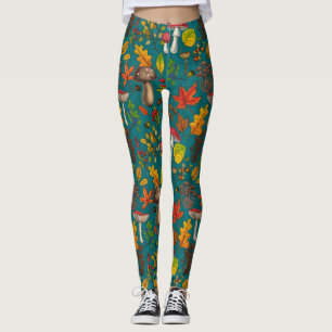 Autumn mushrooms, leaves, nuts and berries on blue leggings