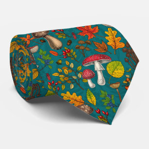 Autumn mushrooms, leaves, nuts and berries on blue neck tie