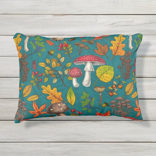 Autumn mushrooms leaves nuts and berries on blue outdoor pillow