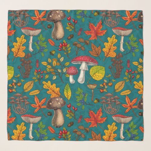 Autumn mushrooms leaves nuts and berries on blue scarf
