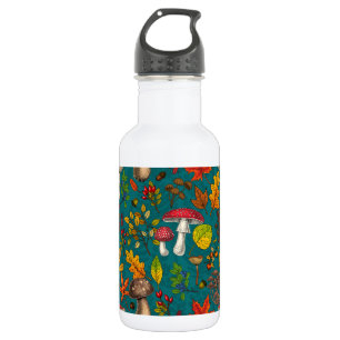 Autumn mushrooms, leaves, nuts and berries on blue stainless steel water bottle