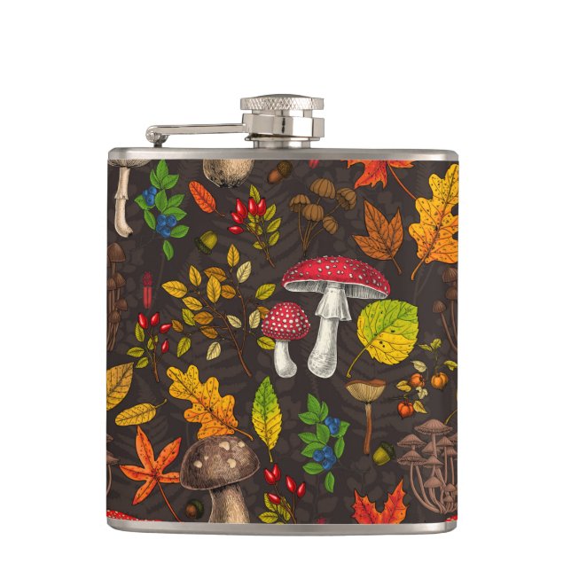 Autumn mushrooms, leaves, nuts and berries on dark flask (Front)