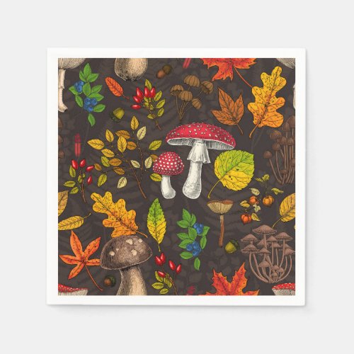 Autumn mushrooms leaves nuts and berries on dark napkins