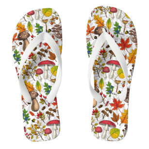 Autumn mushrooms, leaves, nuts and berries on whit flip flops