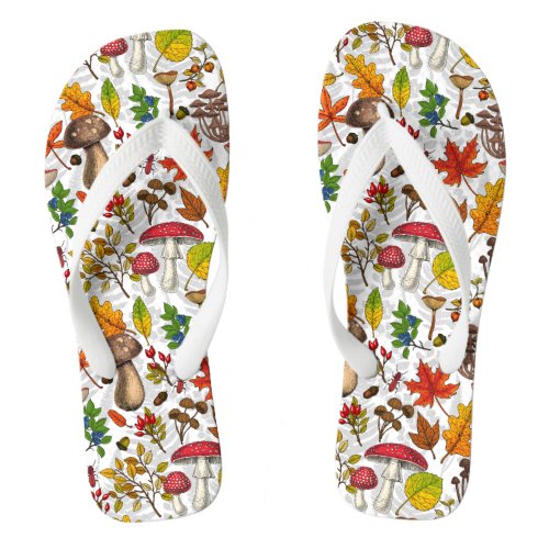 Autumn mushrooms leaves nuts and berries on whit flip flops