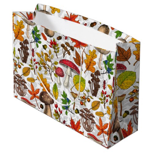 Autumn mushrooms leaves nuts and berries on whit large gift bag