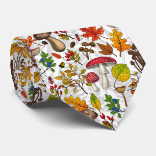 Autumn mushrooms, leaves, nuts and berries on whit neck tie