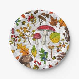 Autumn mushrooms, leaves, nuts and berries on whit paper plates