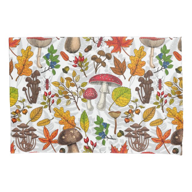 Autumn mushrooms, leaves, nuts and berries on whit pillow case (Front-Left)