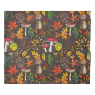 Autumn mushrooms,nuts and berries on dark duvet cover