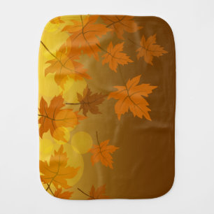 Autumn pattern with falling maple leaves and bokeh baby burp cloth