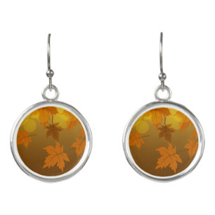 Autumn pattern with falling maple leaves and bokeh earrings
