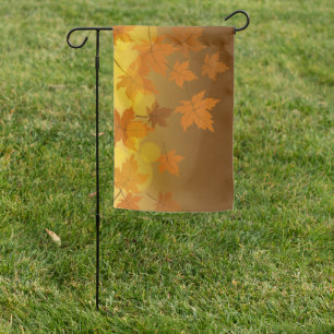Autumn pattern with falling maple leaves and bokeh garden flag