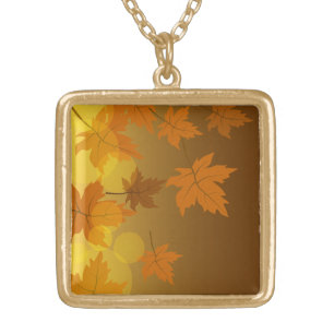 Autumn pattern with falling maple leaves and bokeh gold plated necklace