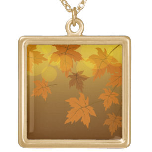 Autumn pattern with falling maple leaves and bokeh gold plated necklace