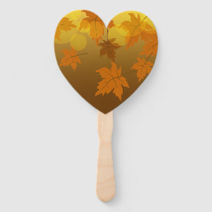 Autumn pattern with falling maple leaves and bokeh hand fan