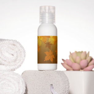 Autumn pattern with falling maple leaves and bokeh hand lotion