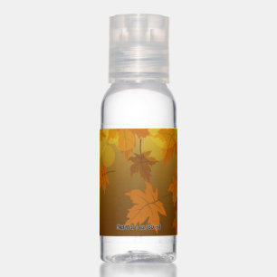 Autumn pattern with falling maple leaves and bokeh hand sanitizer