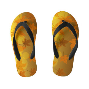 Autumn pattern with falling maple leaves and bokeh kid's flip flops