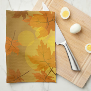 Autumn pattern with falling maple leaves and bokeh kitchen towel