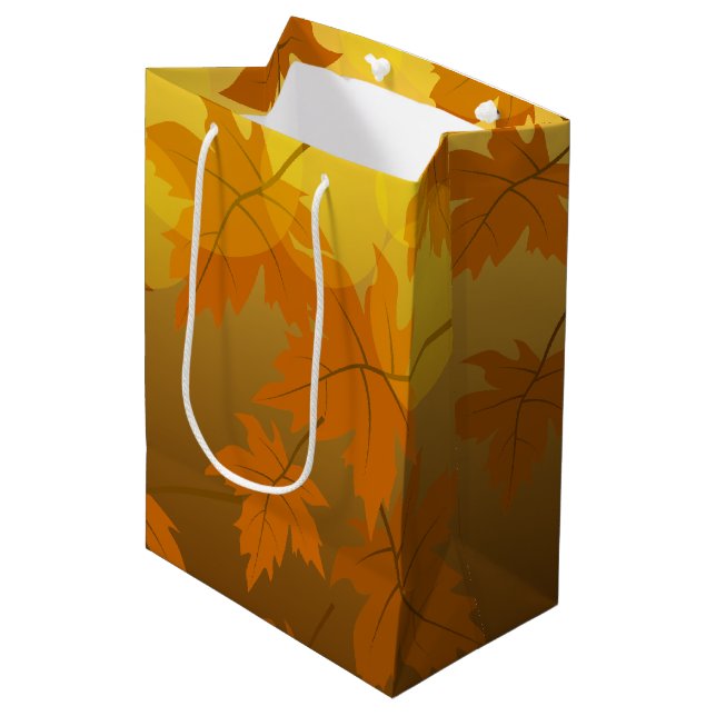 Autumn pattern with falling maple leaves and bokeh medium gift bag (Front Angled)