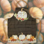 Autumn Pumpkin Foliage Wood Happy Fall Family Name Apron<br><div class="desc">"Autumn Pumpkin Foliage Wood Happy Fall Family Name, Watercolor artwork Apron." Made from watercolor artwork and modern hand painted watercolor pumpkins, colorful leaf foliage and flowers over a dark barn wood, shiplap board background and a lighter wood table filled with pumpkins of all shapes and sizes. Main pumpkin has a...</div>