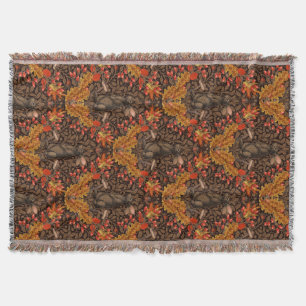 Autumn rabbit on brown throw blanket