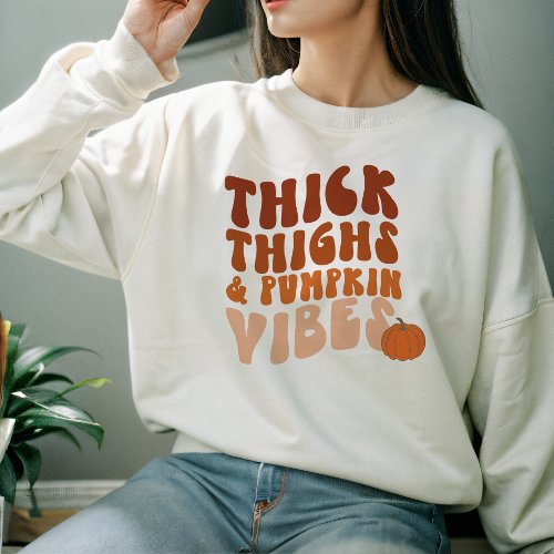 AUTUMN THEMED GROOVY THICK THIGHS  SPOOKY VIBES SWEATSHIRT