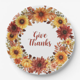 Autumn themed thanksgiving with flowers pumpkins paper plates