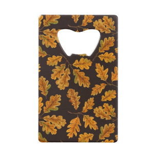 Autumnal oak leaves on dark brown credit card bottle opener