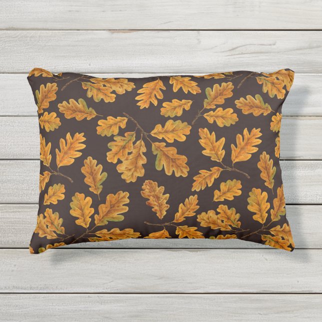 Autumnal oak leaves on dark brown outdoor pillow (Front)