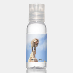 Baboon monkey on top of a mountain hand sanitizer
