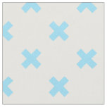 Baby blue cross stitches on white fabric