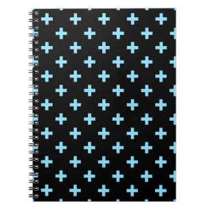 Baby blue polka crosses on black notebook