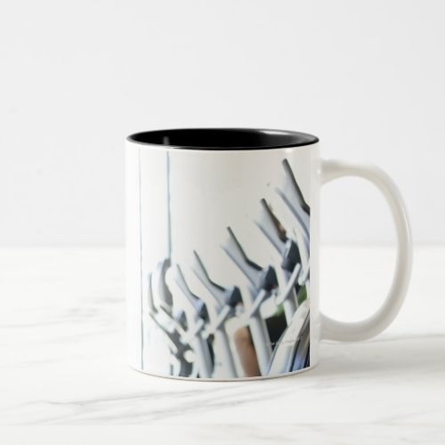 Baby boomer woman working out triceps in health Two_Tone coffee mug
