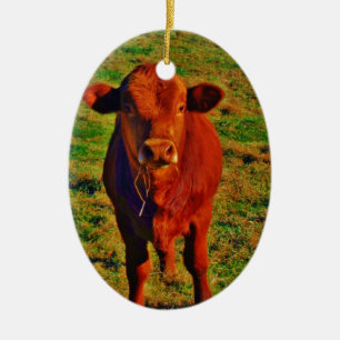 BABY BROWN COW EATING CERAMIC ORNAMENT