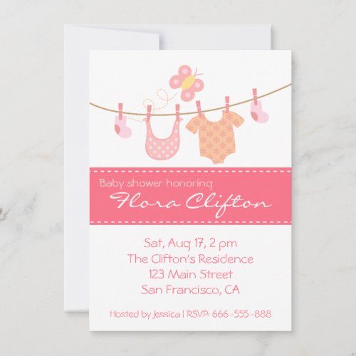 Baby clothes hanging on clothesline with butterfly invitation