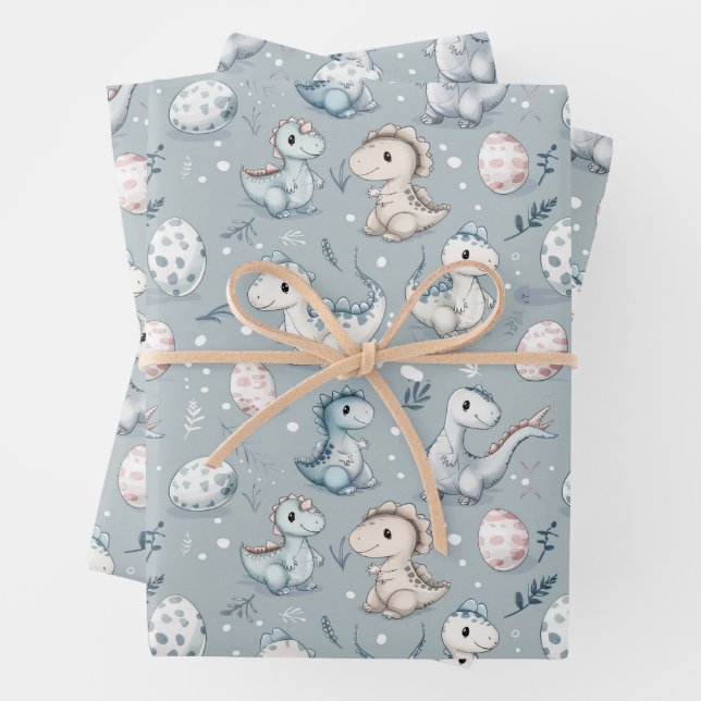Baby dinosaurs on blue wrapping paper sheets (In situ)