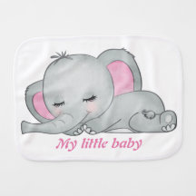 Baby elephant with pink ears sleeping