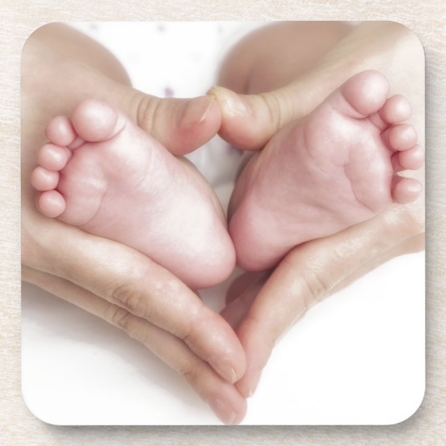 Baby feet in mother hands beverage coaster (Front)