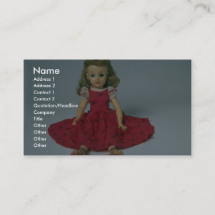 Baby girl doll dressed in red business card
