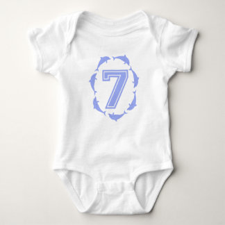 Baby learns number 7 in blue bodysuit