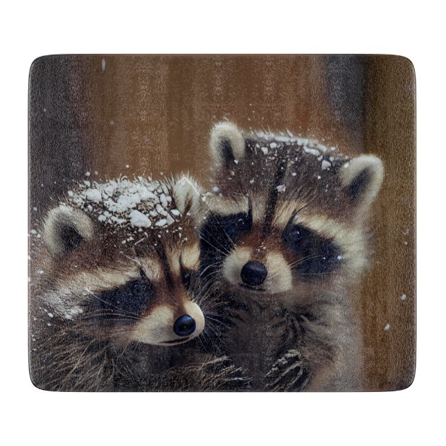 Baby Raccoons Huddle in Falling Snow Glass Cutting Board (Front)