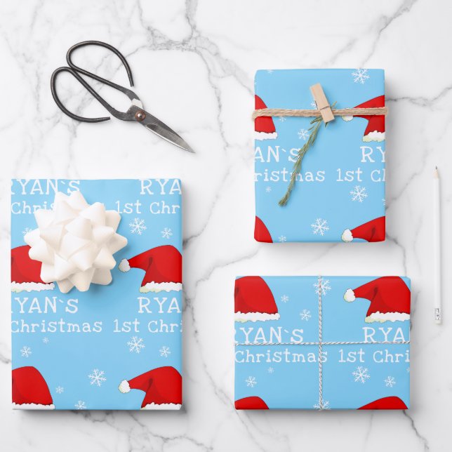 Baby`s First Christmas Blue Santa Hat Snowflake Wrapping Paper Sheets (Front)
