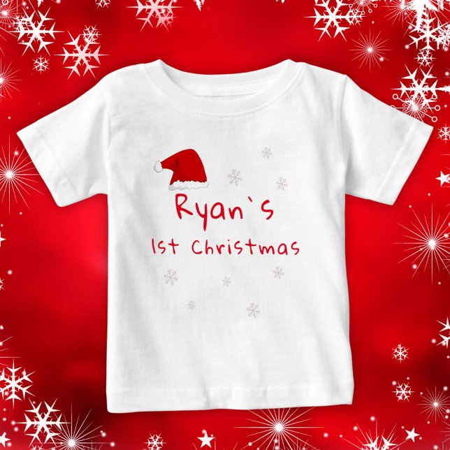 Baby`s First Christmas Santa Hat Snowflakes Baby T-Shirt (Creator Uploaded)