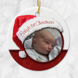 Baby's 1st Christmas - Santa Hat Photo Ornament<br><div class="desc">Celebrate your baby's first Christmas with a personalized Baby's 1st Christmas - Santa Hat Photo Ornament. This adorable ornament is designed with your baby's photo in a circle that sits within the opening of a red and white Santa hat that reads "Baby's 1st Christmas". The back side of the ornament...</div>