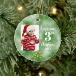 Baby's 3rd Christmas One Photo Round Ceramic Ornament<br><div class="desc">Celebrate your child's 3rd Christmas with a memento ornament for your tree. This ceramic ornament is a great way to start a family tradition and a heritage gift for your child later in life. Traditional Christmas green is the background. Add your photo of your little one, customize the name and...</div>