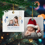 Baby's First Christmas Blue Seashell Holiday Photo Ceramic Ornament<br><div class="desc">Baby's First Christmas Blue Seashell Holiday Photo Ornament on Coastal Wood Holiday. Christmas Photo Ornaments featuring ocean navy blue and sandy tan shell ornaments hanging from sailing jute rope on coastal shiplap wood with elegant typography. Add two of your photos and a personal message for a fun nautical holiday ornament...</div>